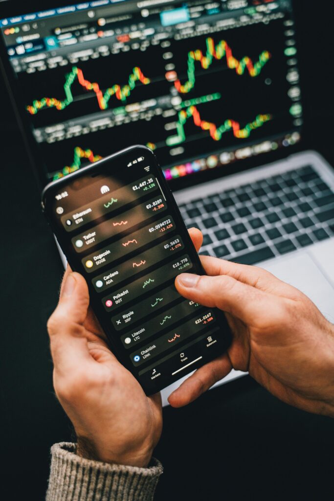 Student tracking credit card expenses on smartphone.