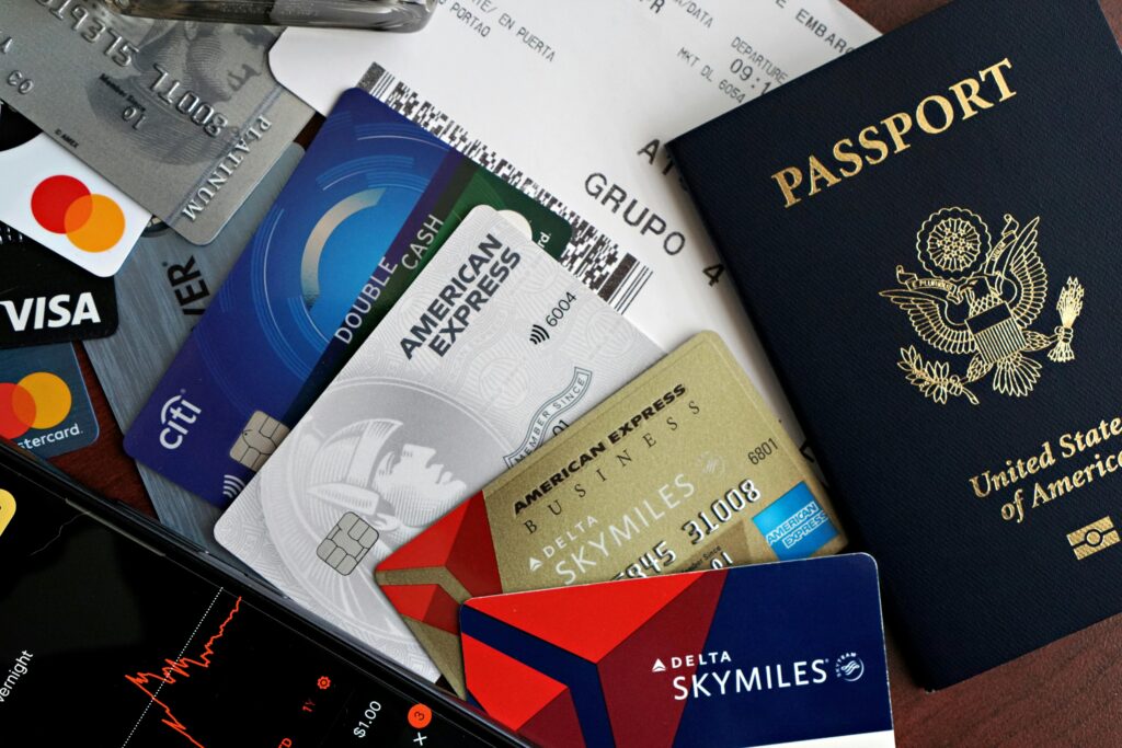 Student traveler holding a credit card at the airport.
